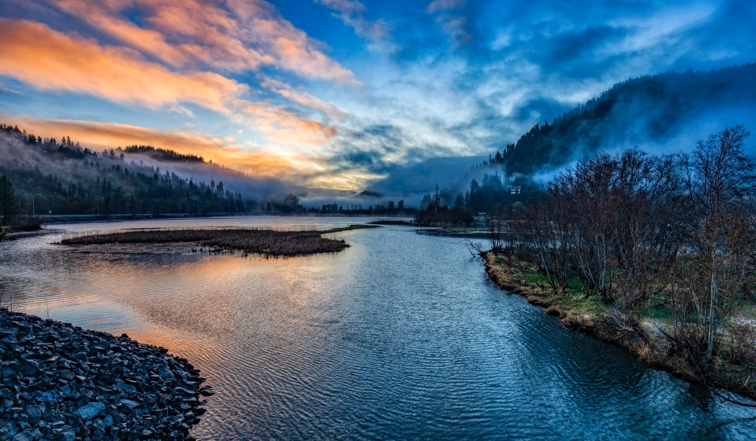 Mist rising off a river at dawn below the Amelia County mountains.
